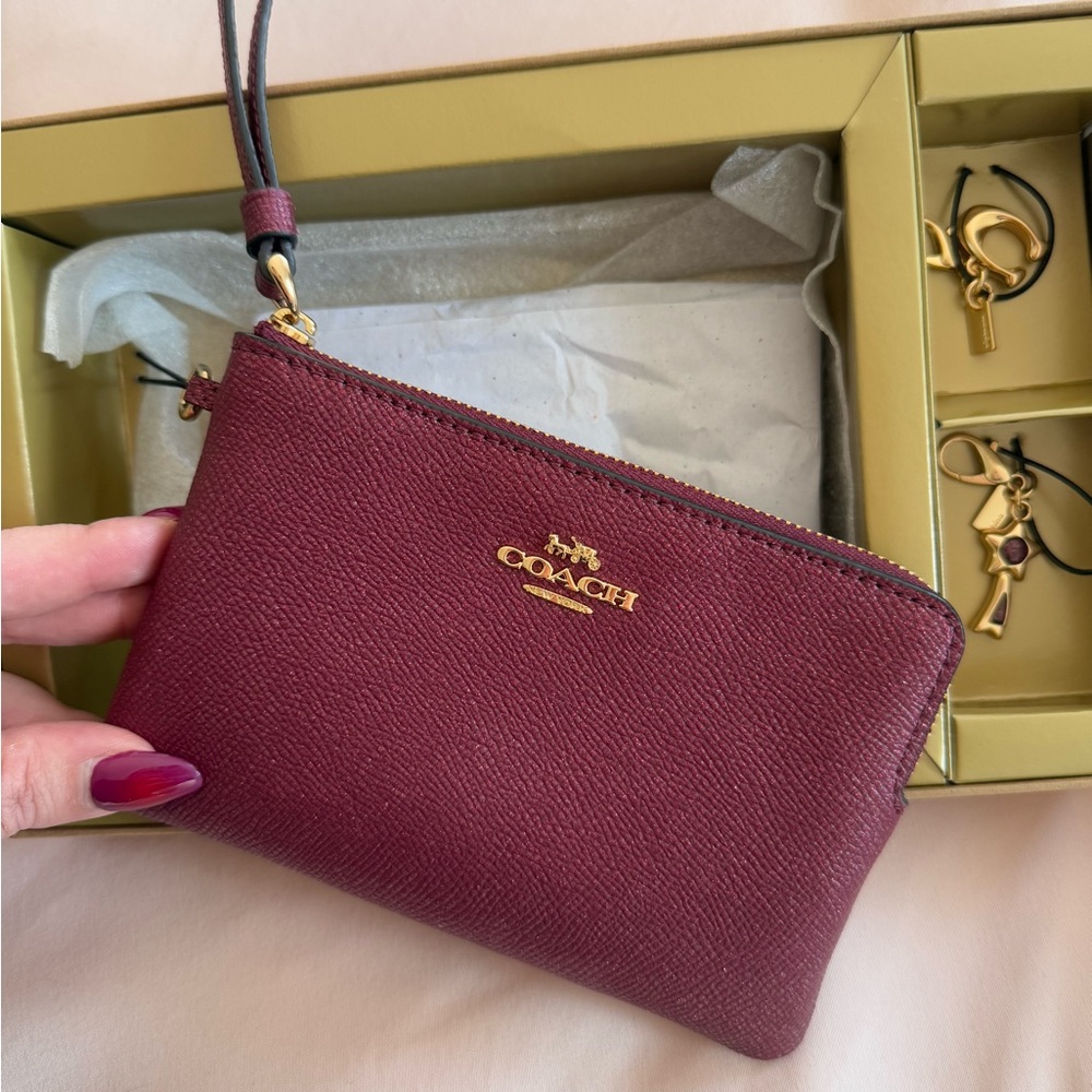 NWT: COACH WRISTLET- Raspberry/Burgundy/Wine Colour. Gift Set with 2 gold charms